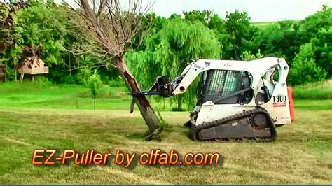 skid steer tree puller youtube|skid loader tree puller attachment.